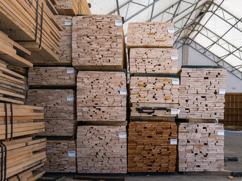 Stacks of lumber planks in a warehouse